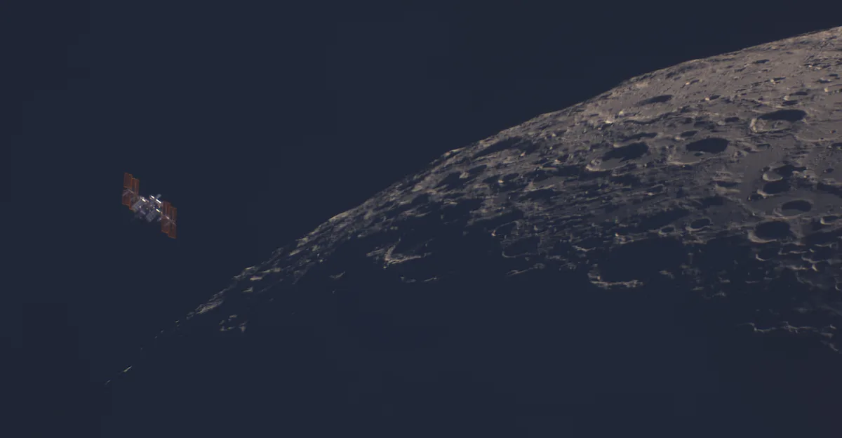 An image showing the International Space Station passing close to the Moon with part of the lunar surface in shadow and craters visible on the part that is lit